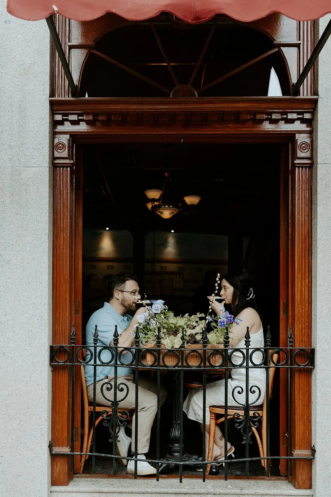 A couple taking bar engagement photos