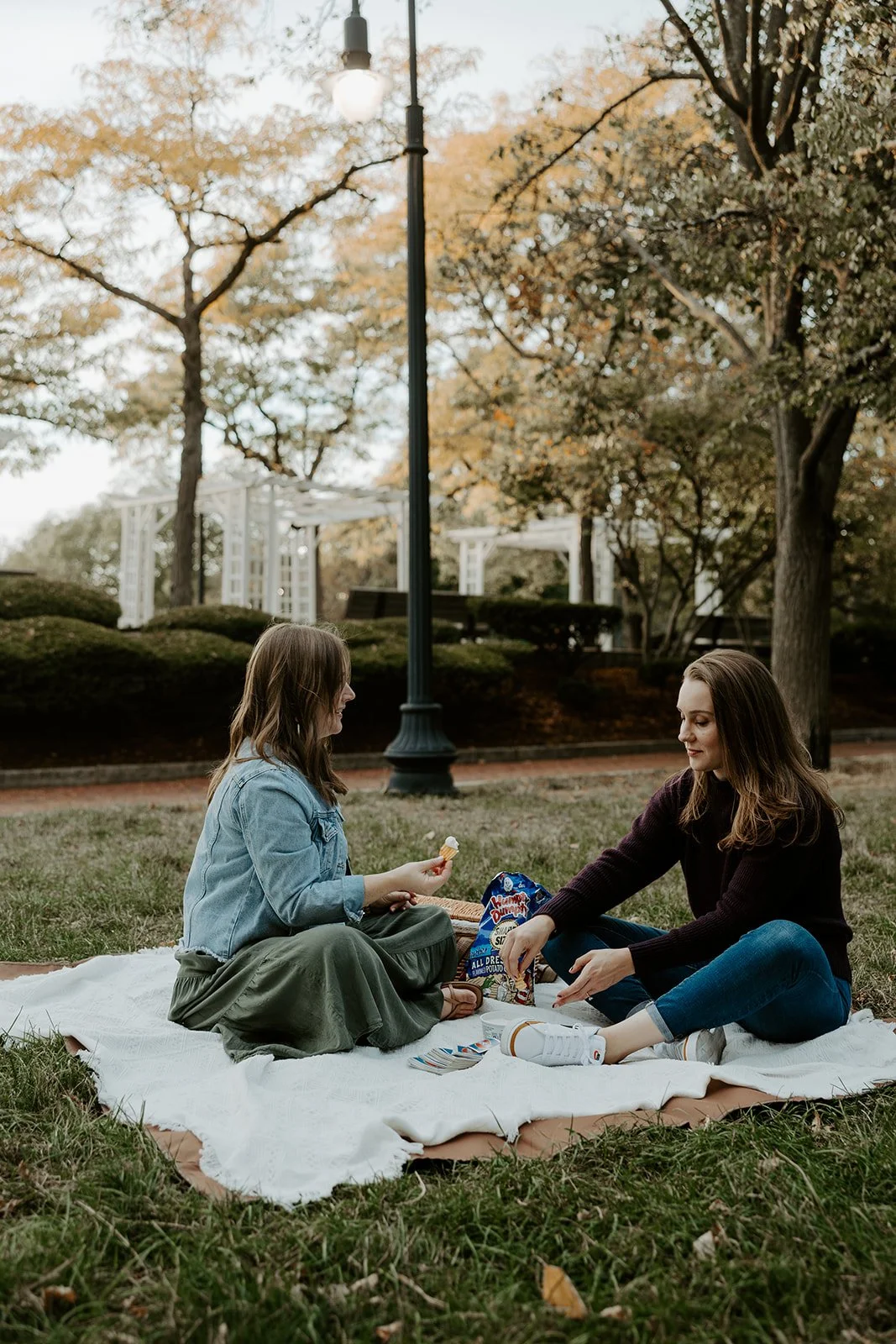A couple playing phase 10 for date-night engagement photos