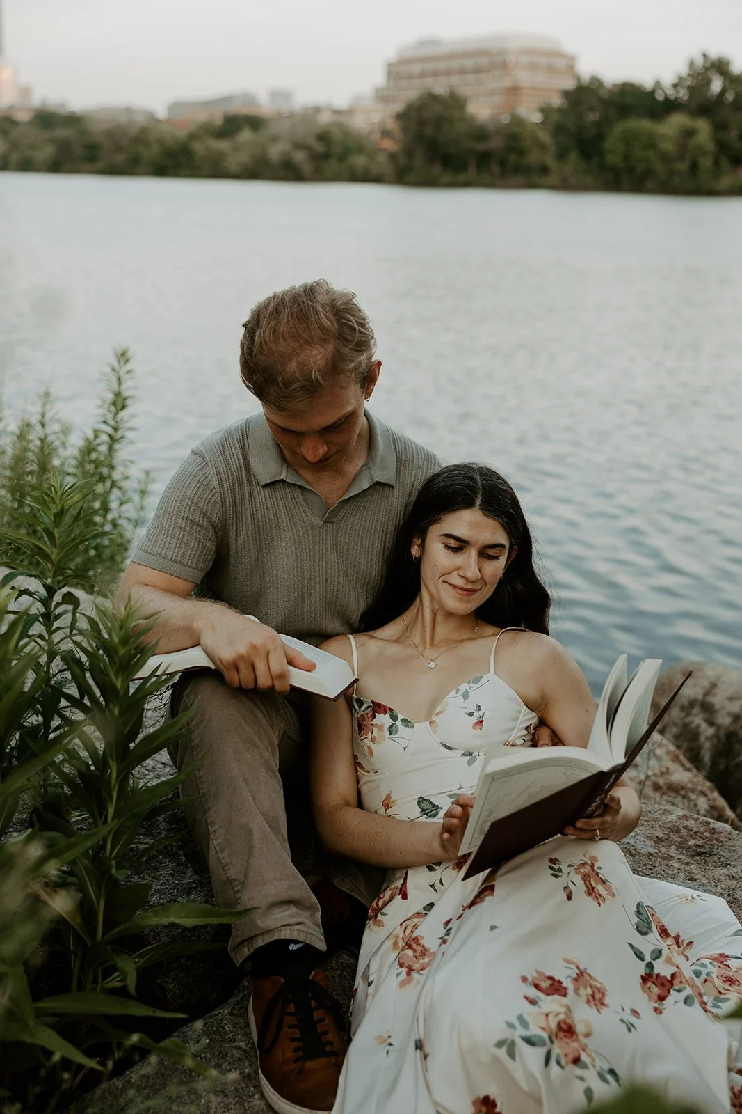A couple reading for their date night engagement photos