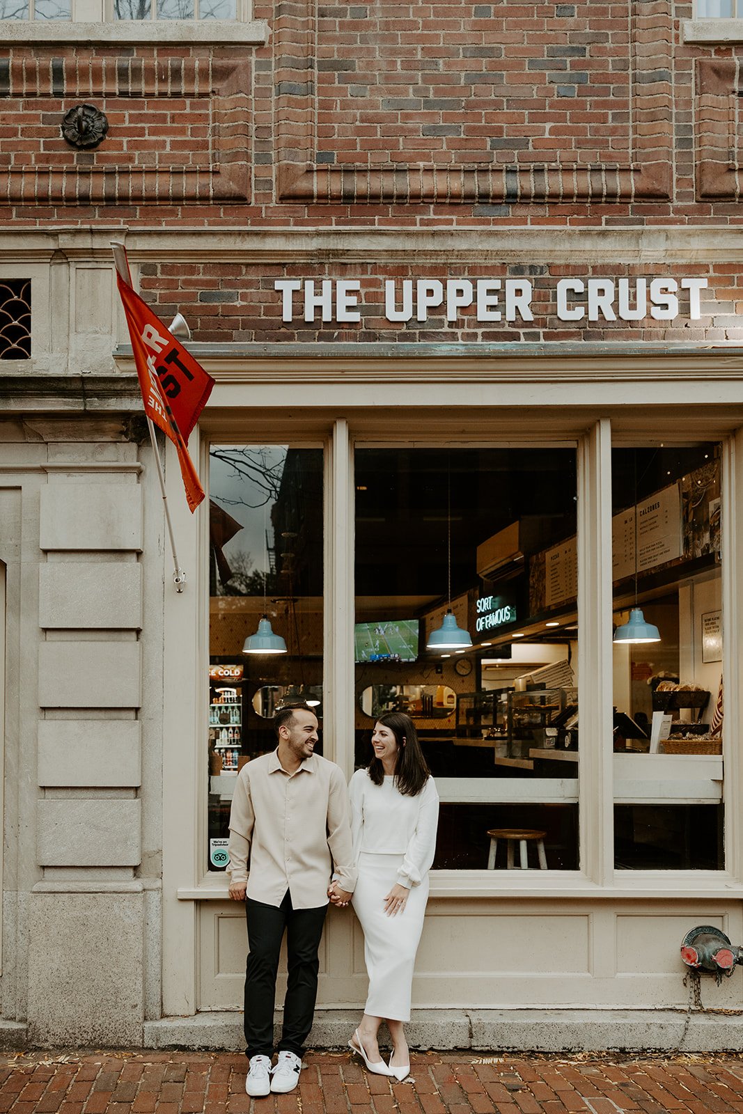 A couple taking date night engagement photos