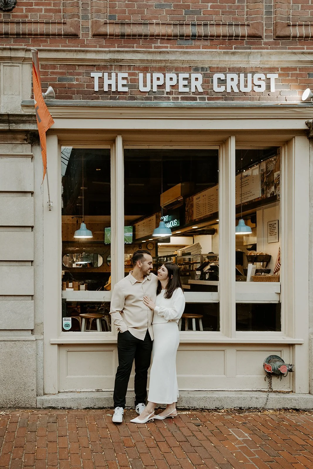 A couple taking date night engagement photos