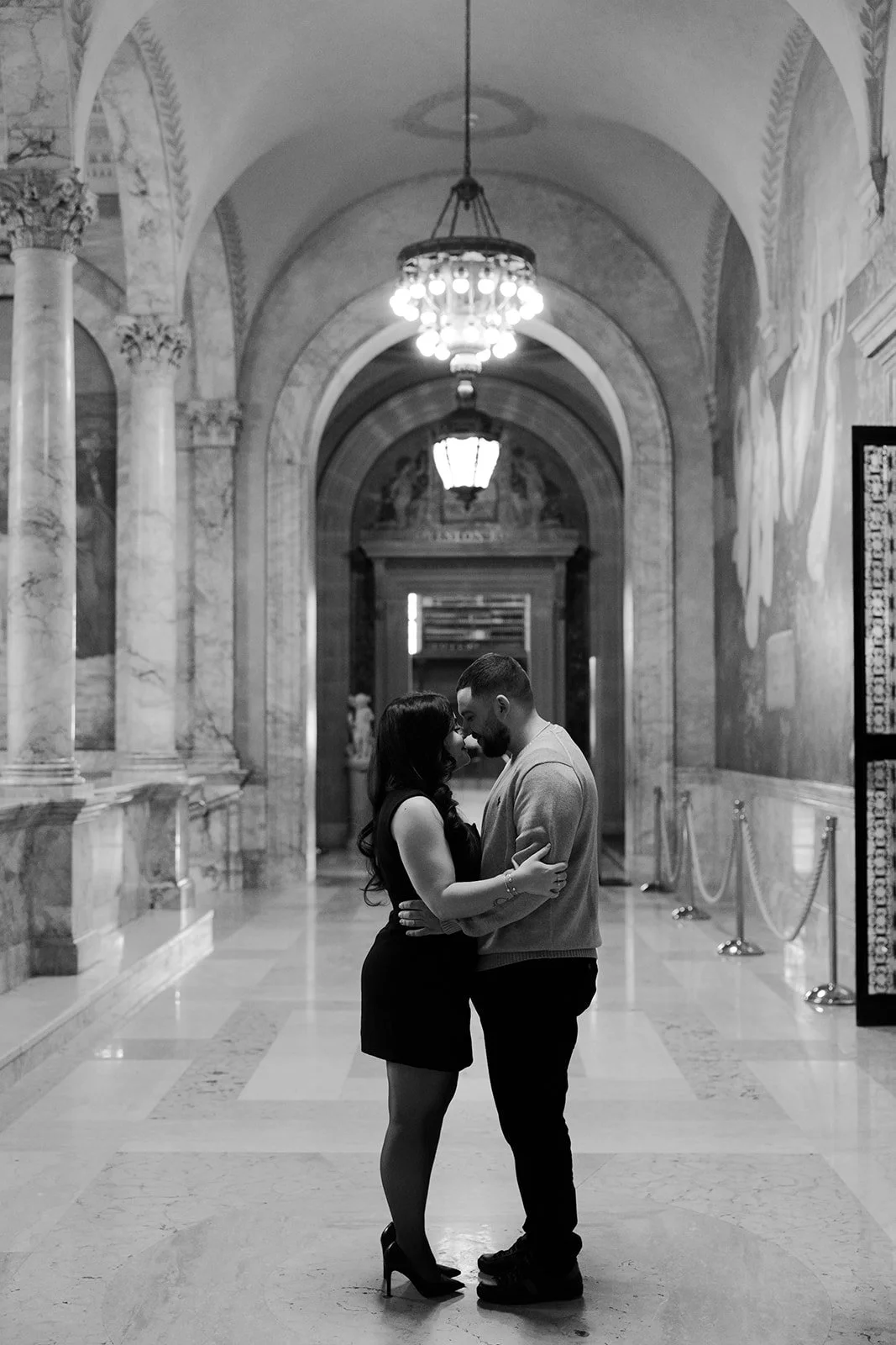 A couple taking date night engagement photos