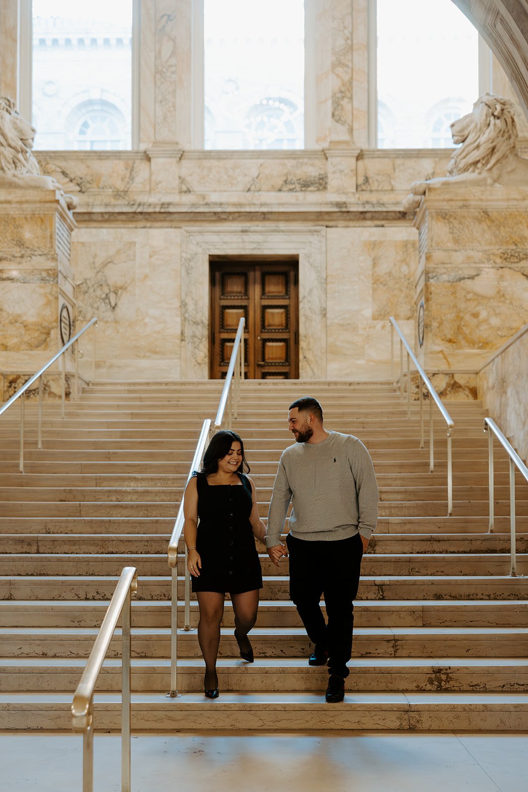 A couple in classy engagement photo outfits