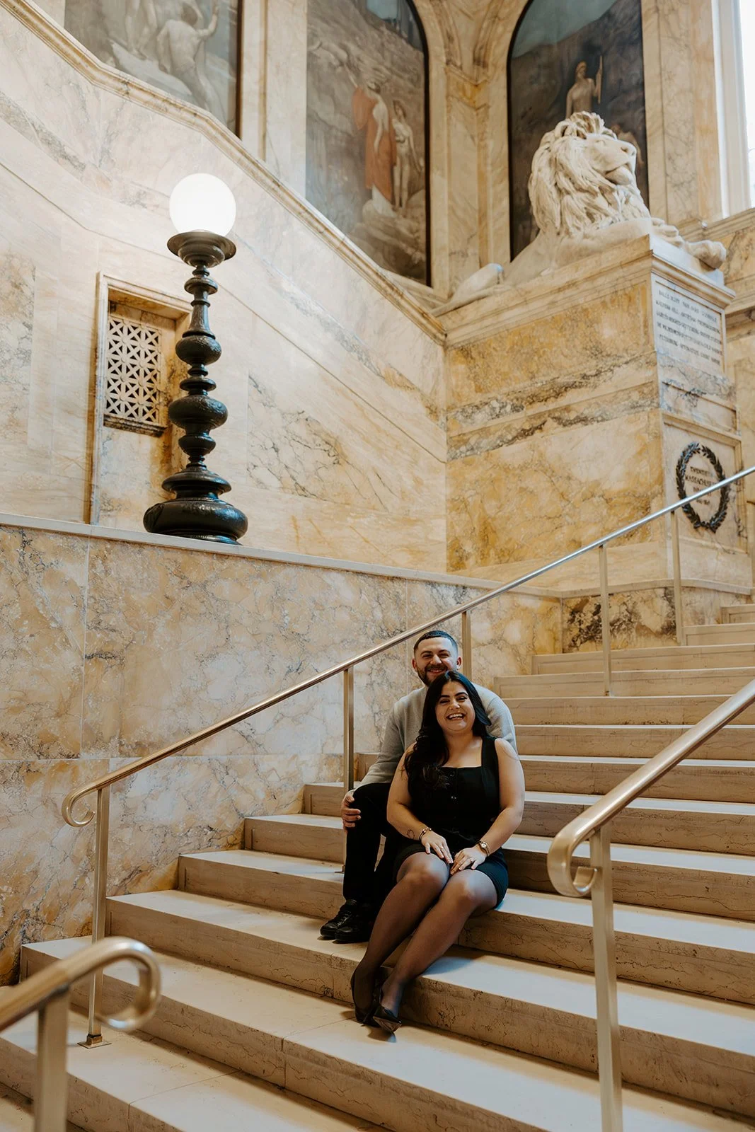A couple in classy engagement photo outfits