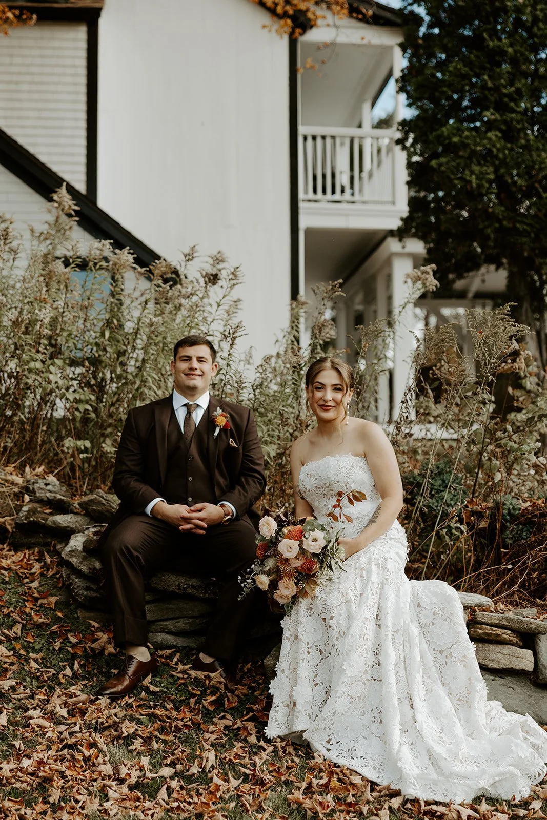 A couple taking fall wedding photos at Farm Road Estate