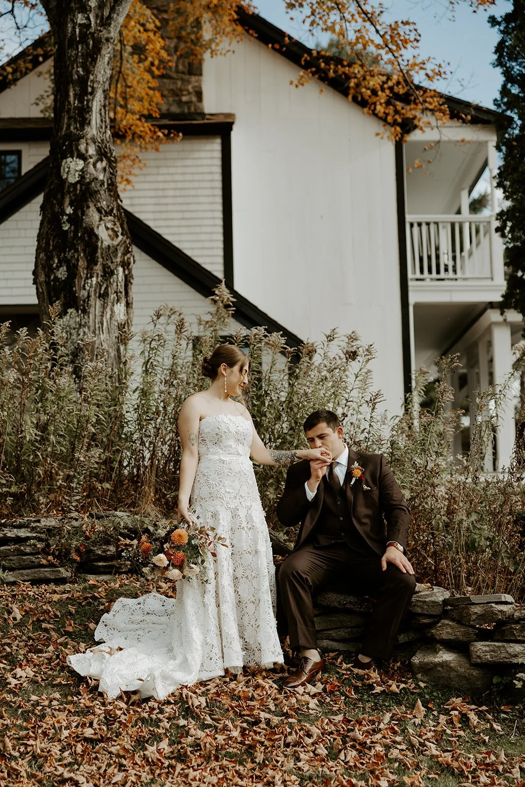 A couple taking fall wedding photos at Farm Road Estate