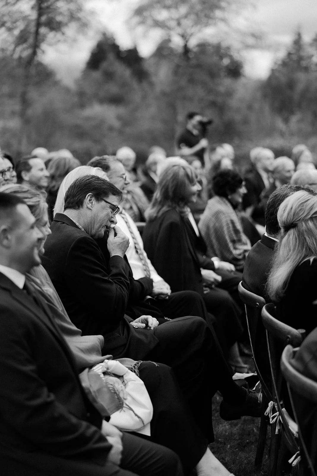 A man crying during a wedding ceremony
