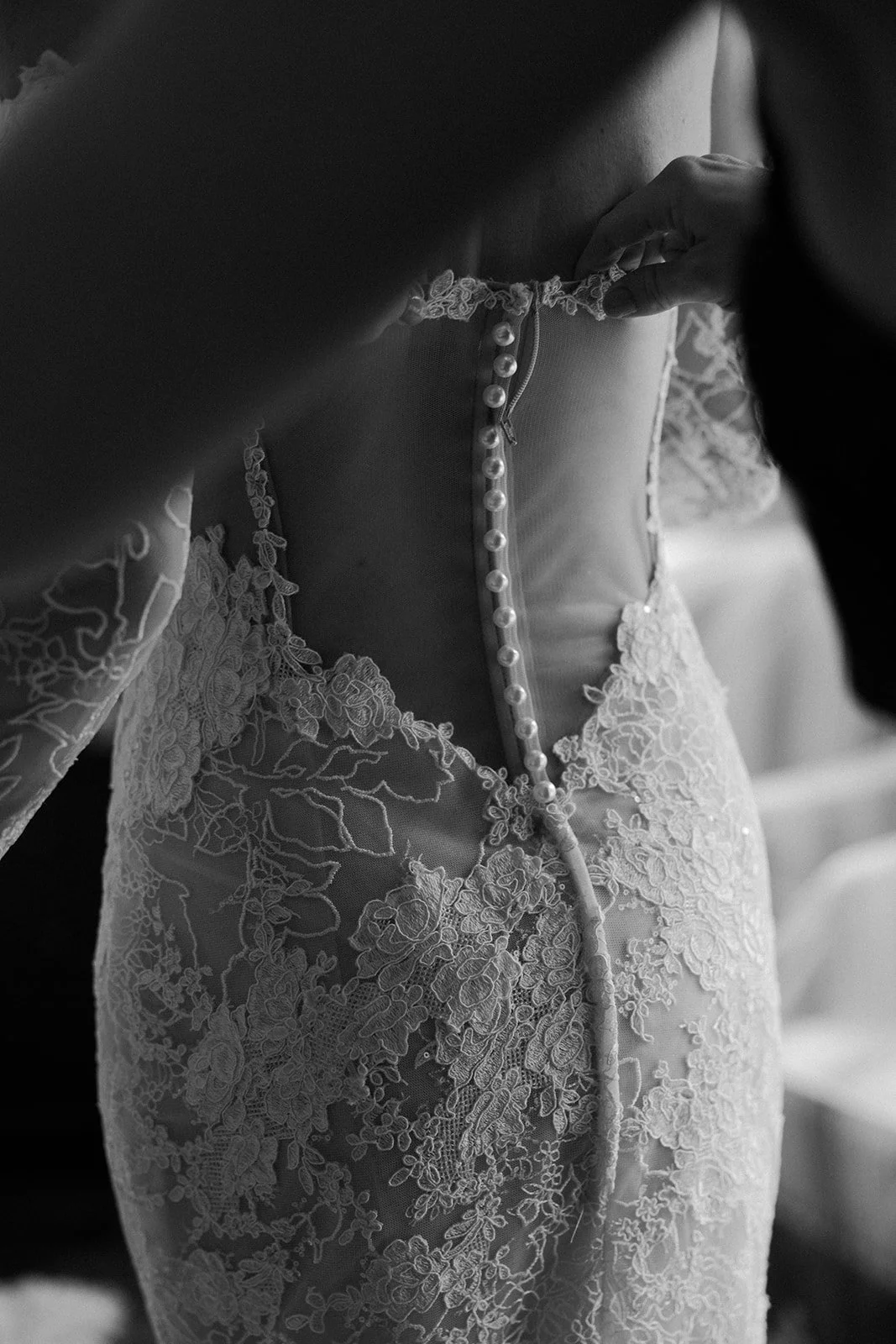 A bride getting into her wedding dress