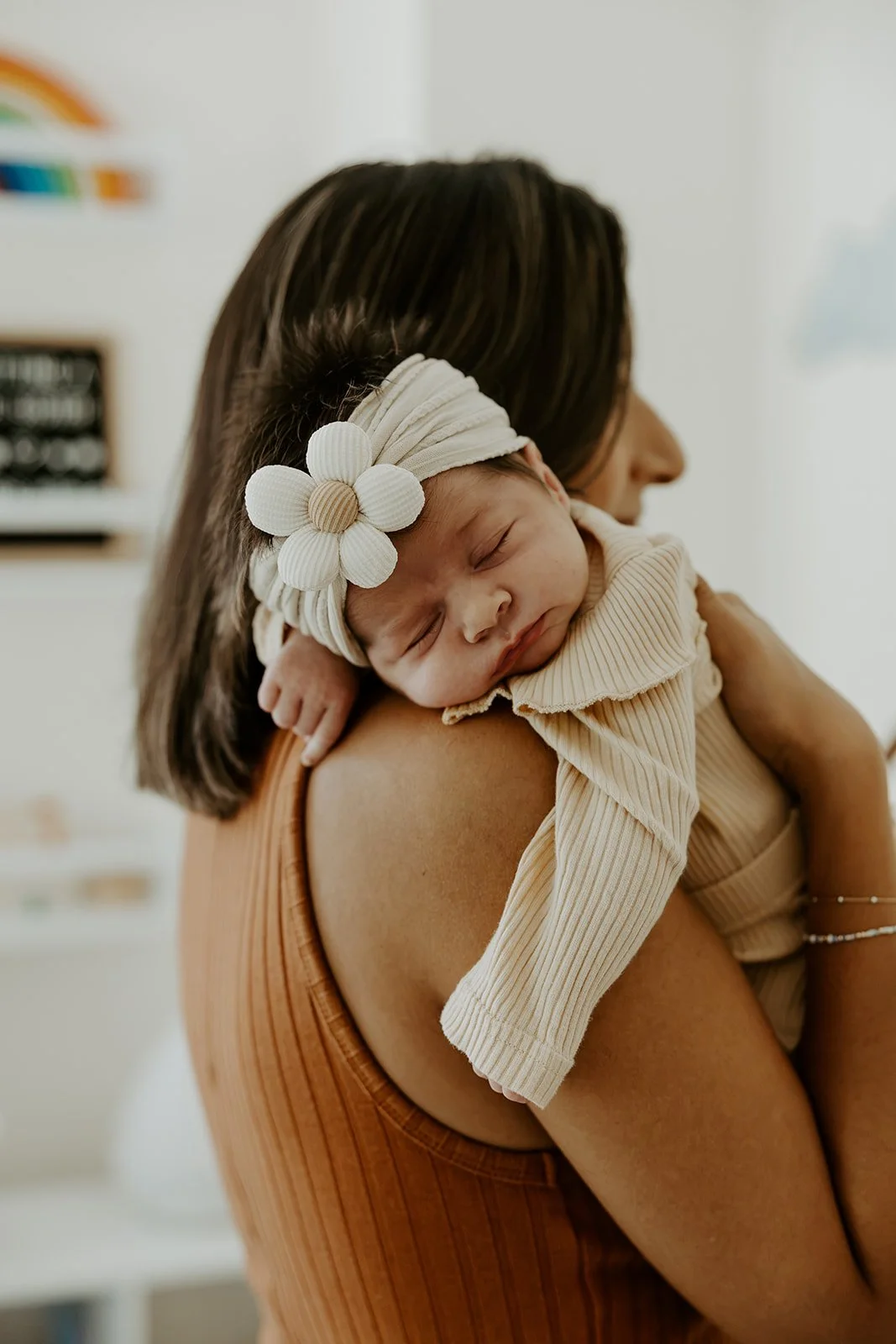 A mom with her newborn baby, by a Boston newborn photographer