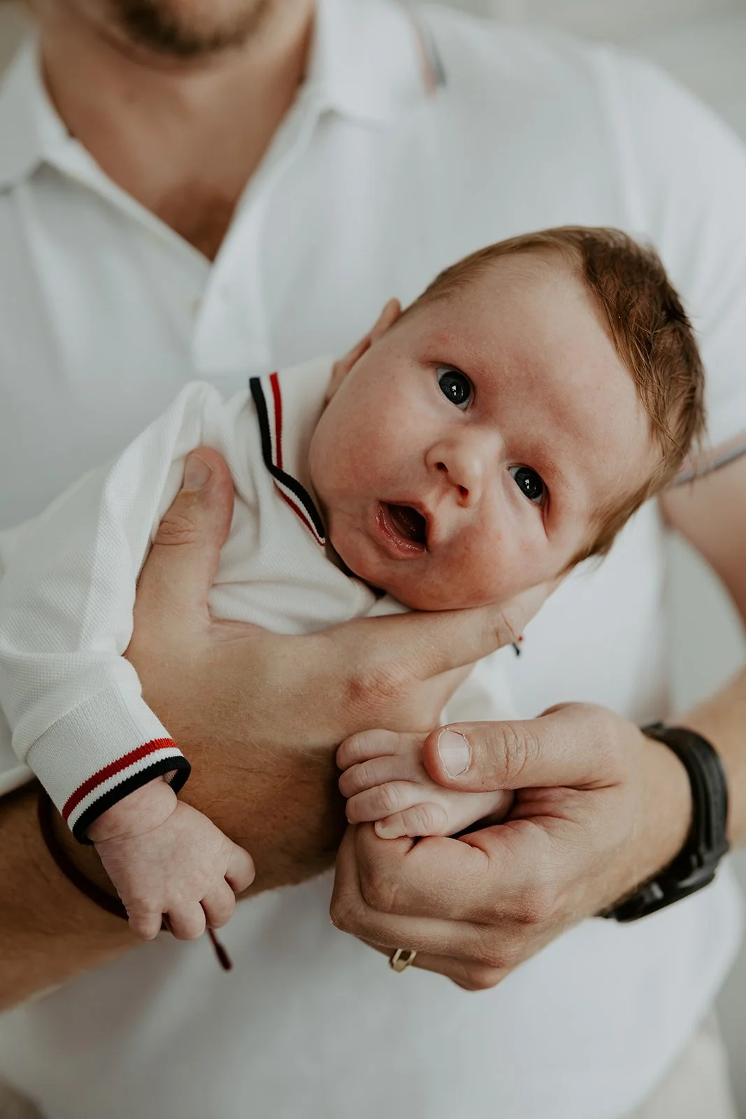 A baby in a newborn photoshoot by a Boston newborn photographer