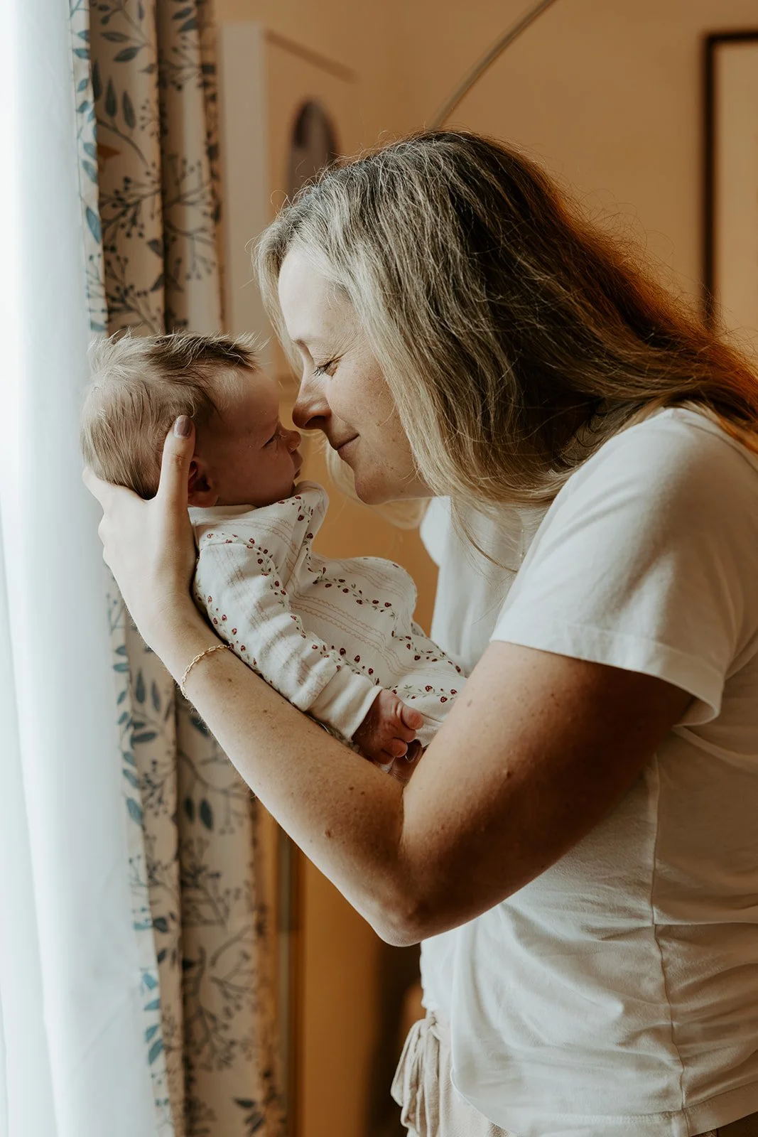 A mom and her newborn baby, by a Boston newborn photographer