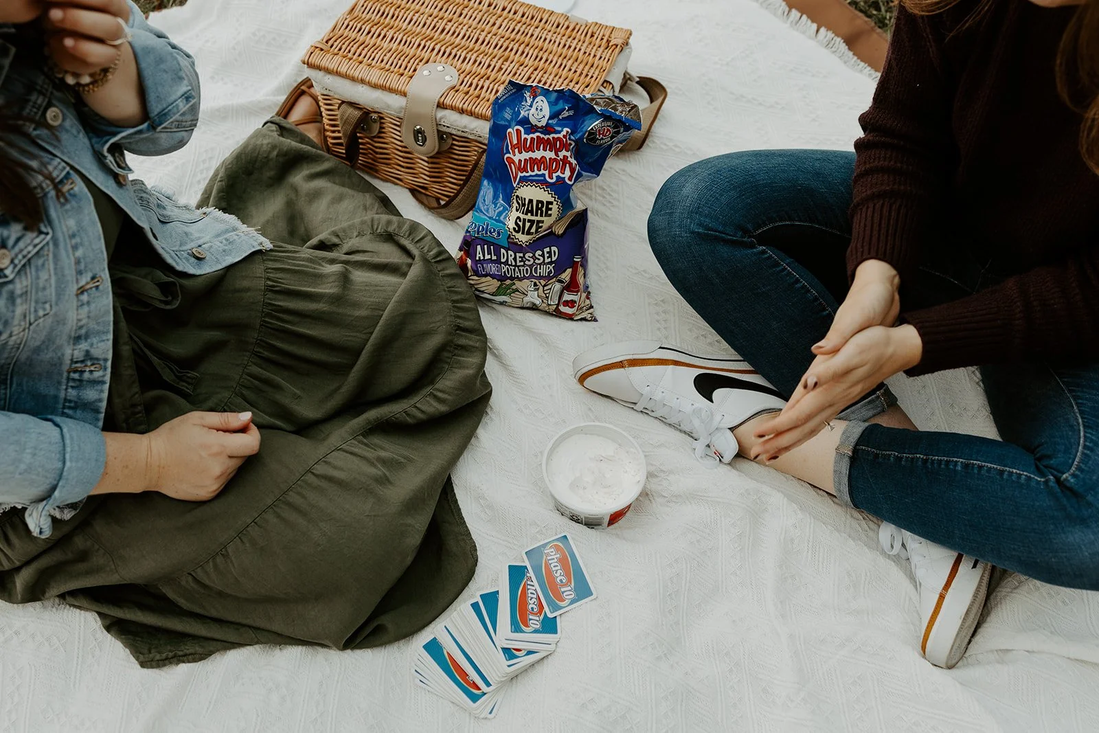 A couple at a picnic date night engagement photoshoot