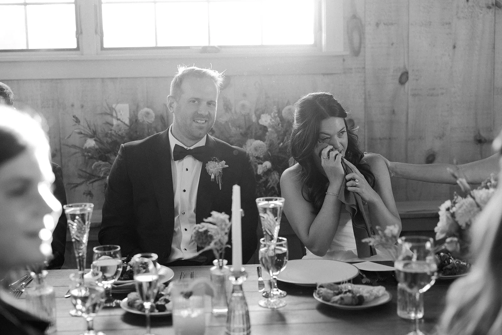 A bride crying during wedding toasts
