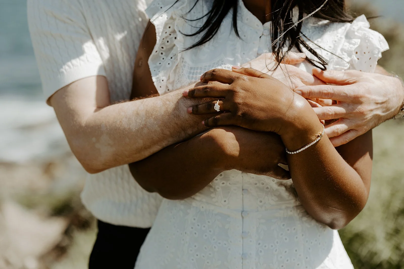A close-up image of a couple's engagement photo outfits