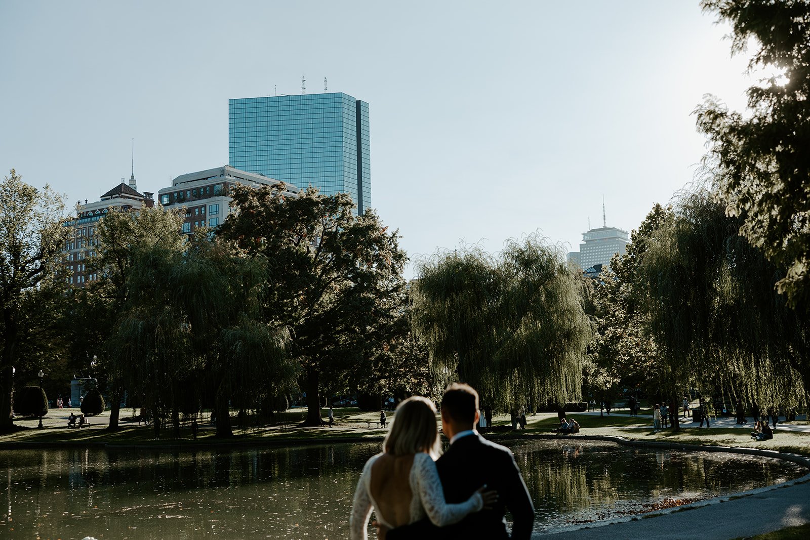 A couple taking photos at their boston public garden elopement