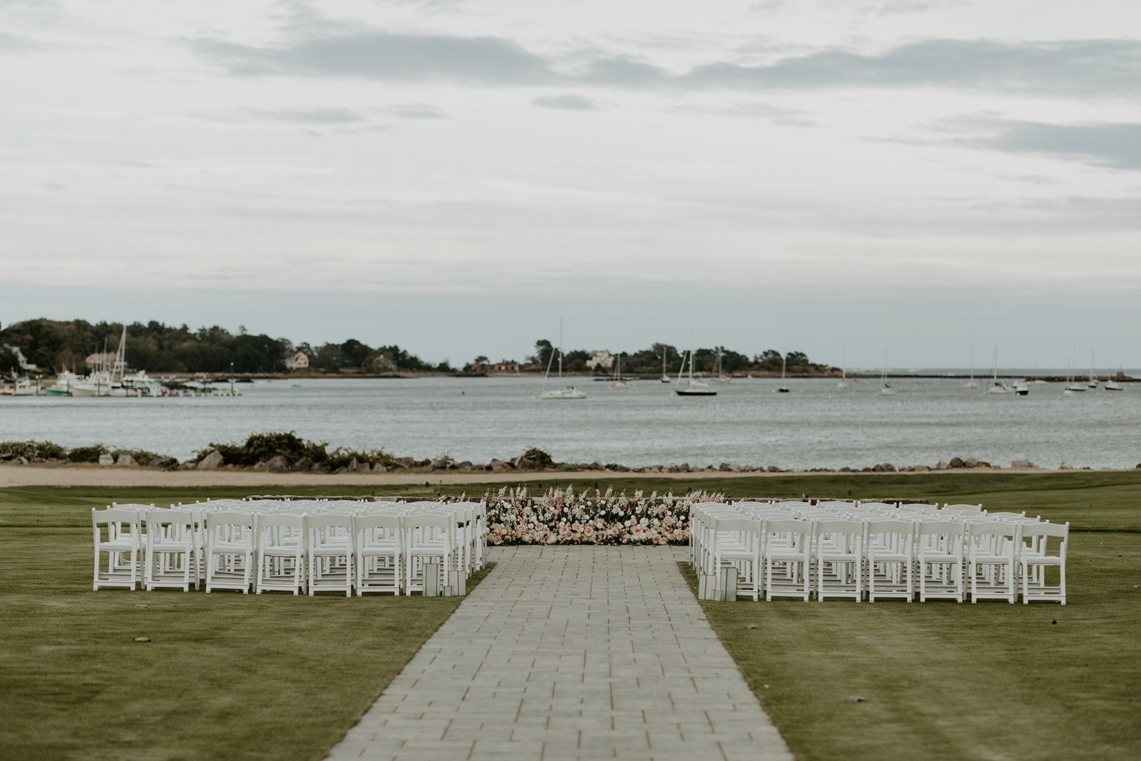 A wedding ceremony setup at a waterfront new hampshire wedding venue