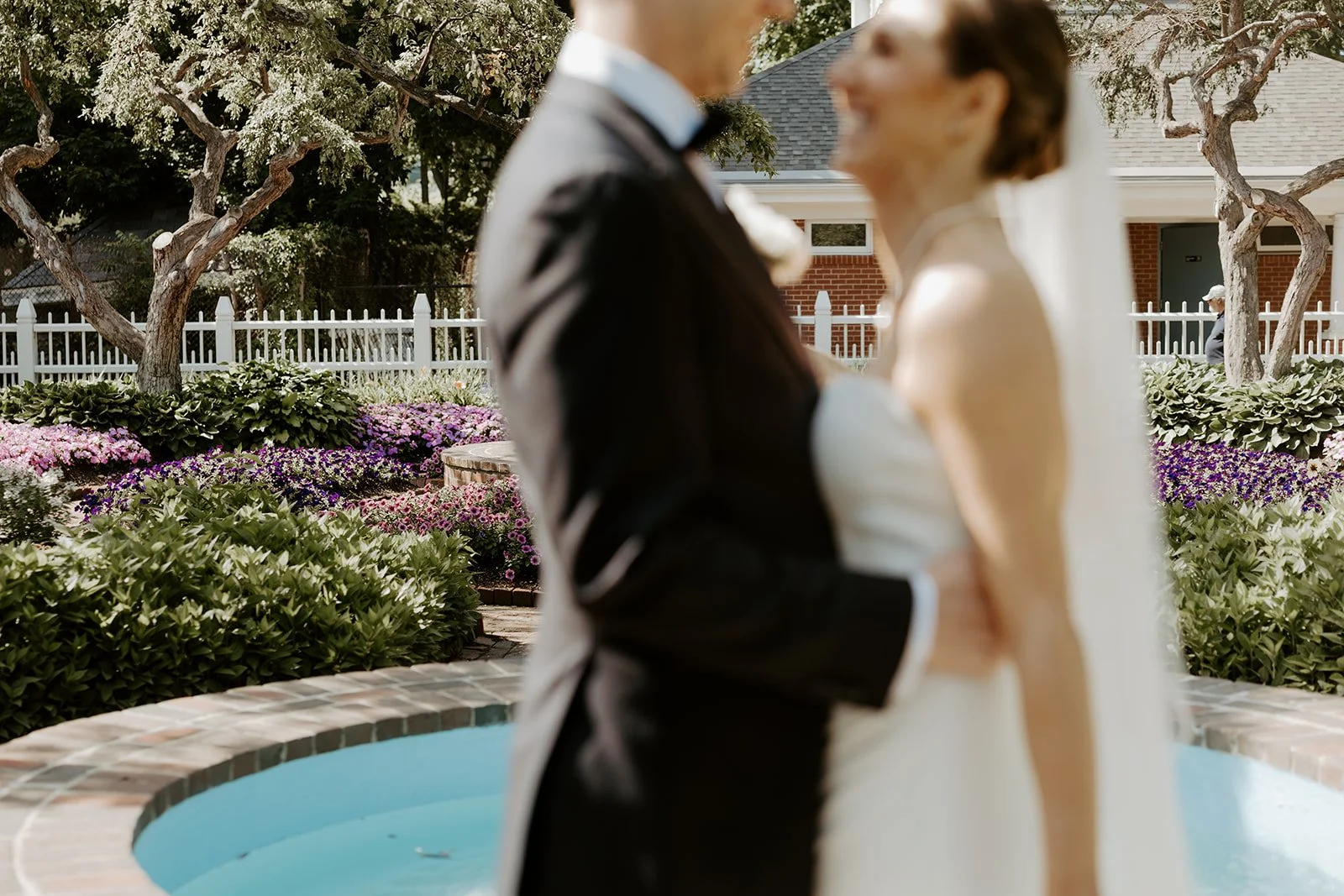 A bride and groom posing for wedding photos with a Boston wedding photographer