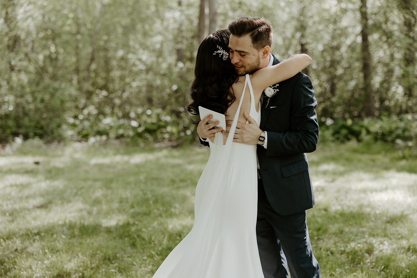 A couple hugging in a candid wedding photo