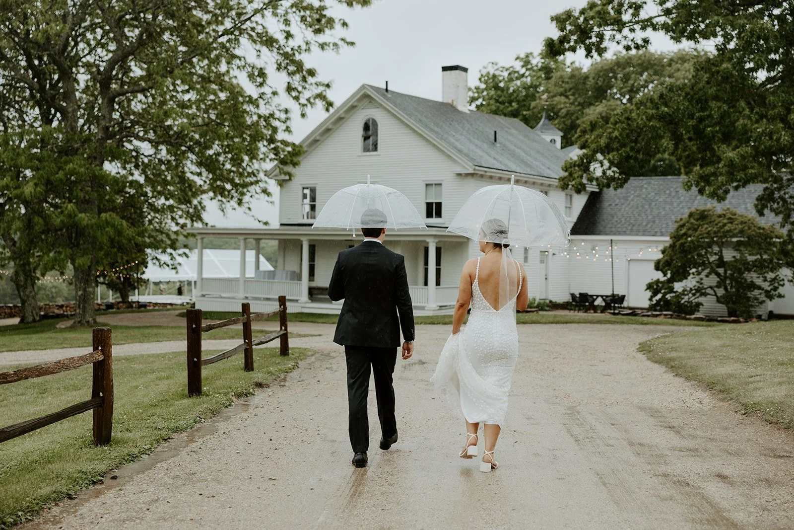 A bride and groom walking to their Maine wedding venue