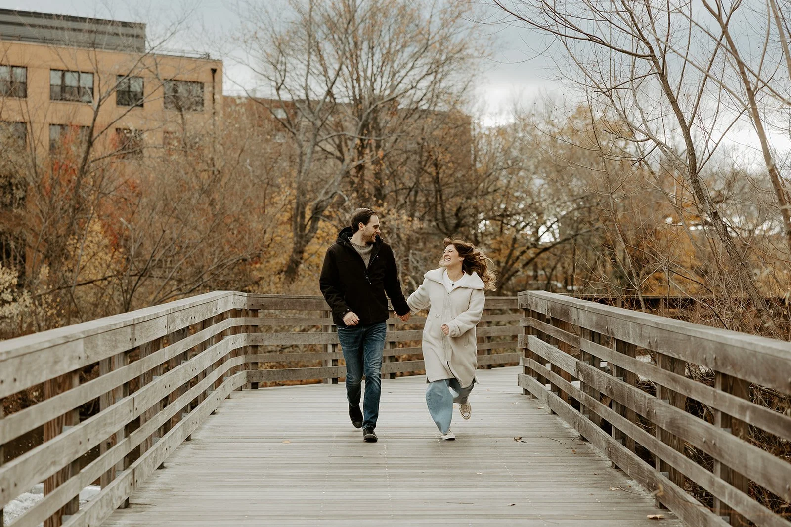 A couple in jackets, showing what to wear for engagement photos in the winter