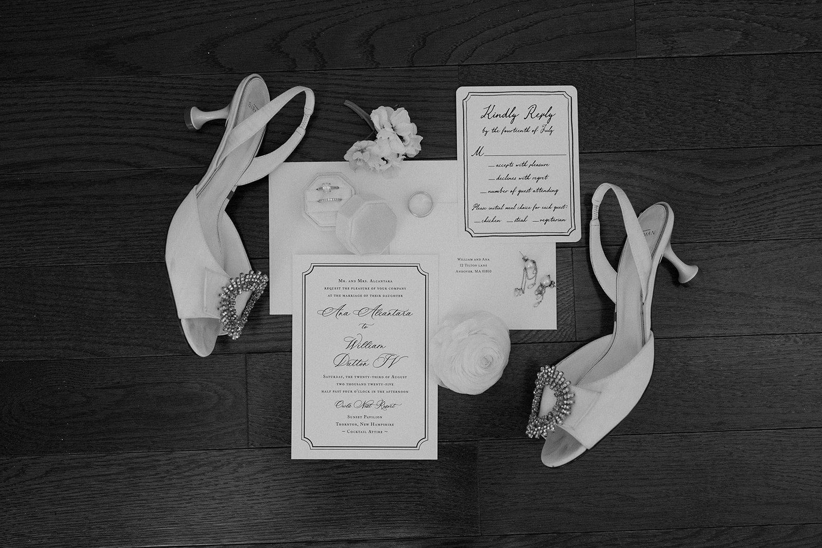 A wedding flat lay with wedding invitations