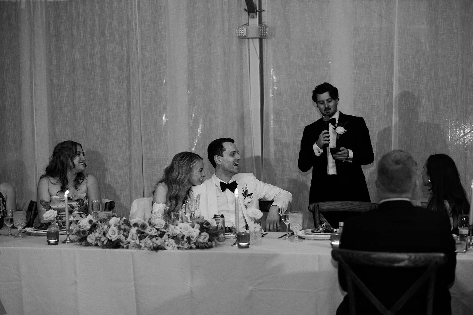 A candid wedding reception photo from a Farm Road Estate wedding