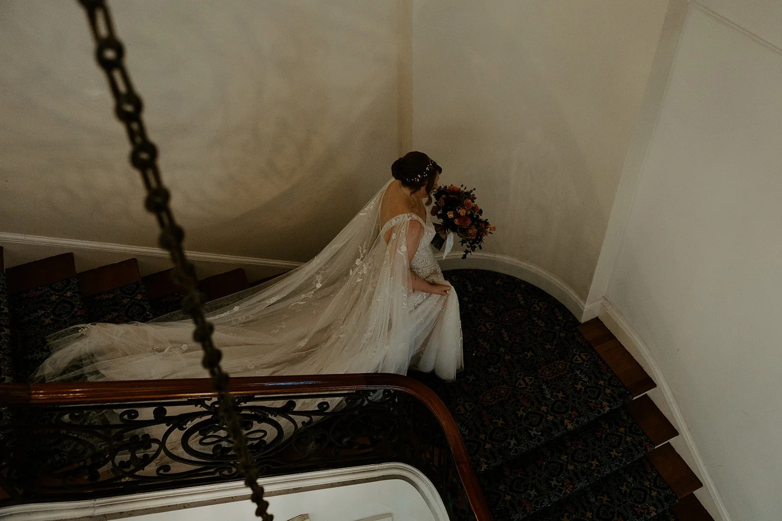 A bride walking down stairs