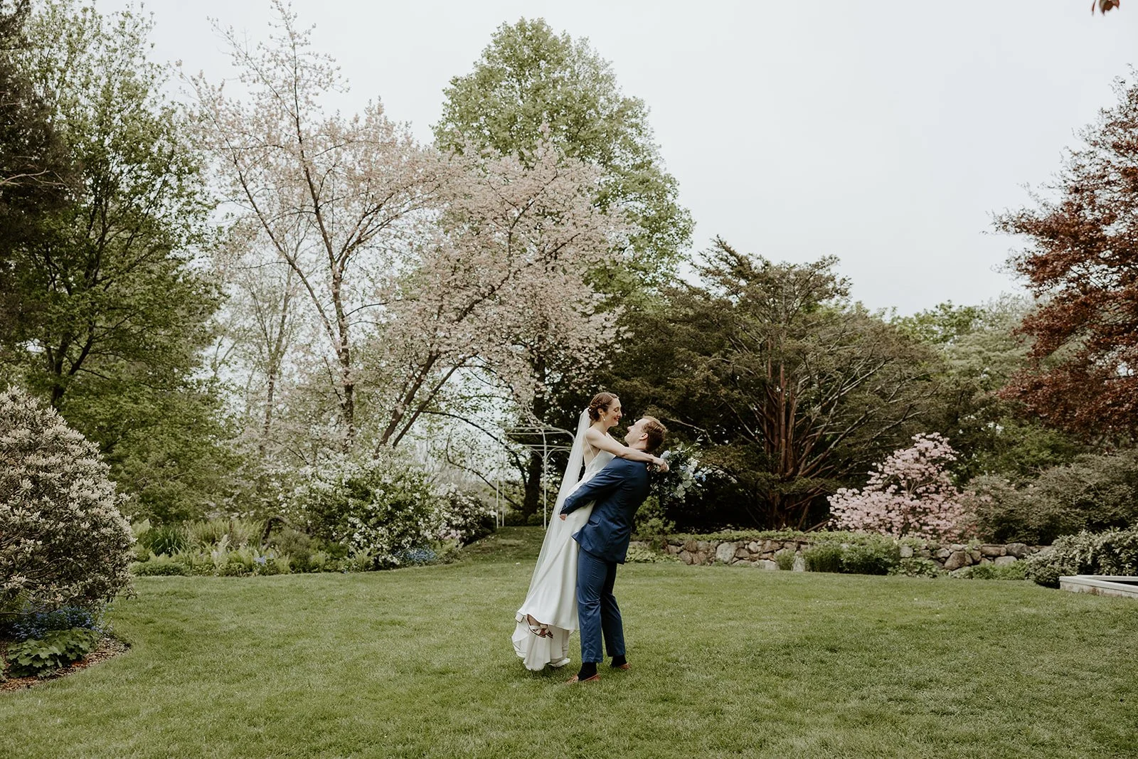 A bride and groom taking spring wedding photos