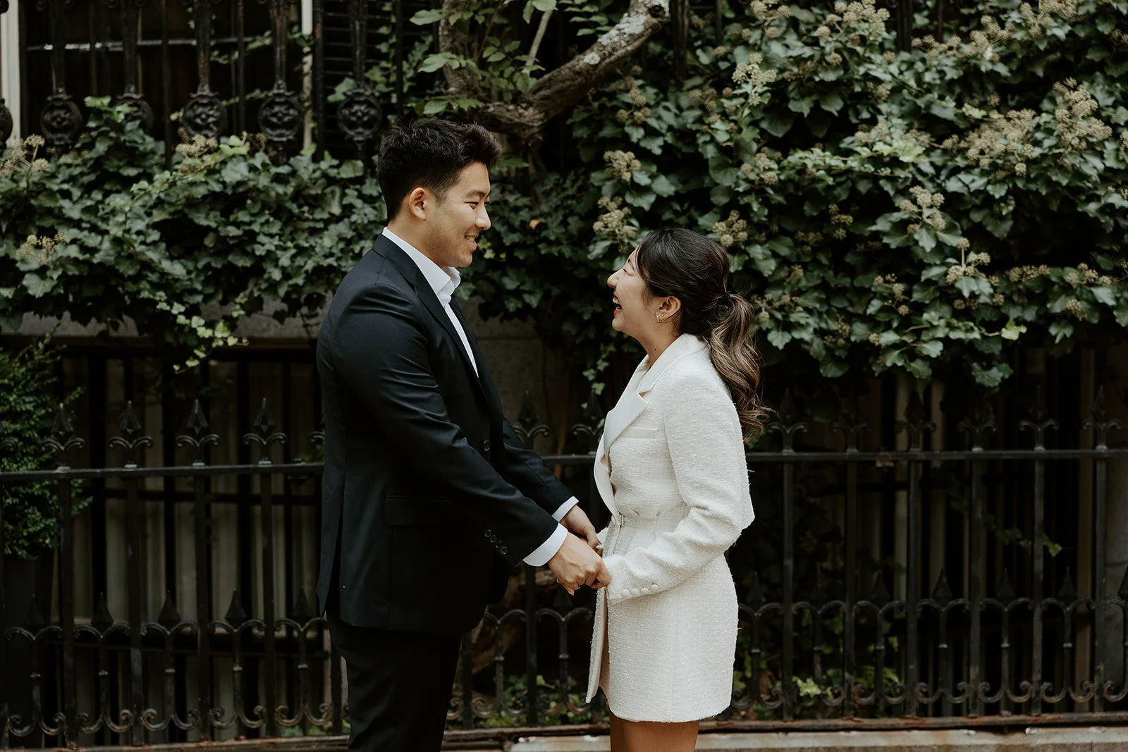 A couple in black and white engagement photo outfits