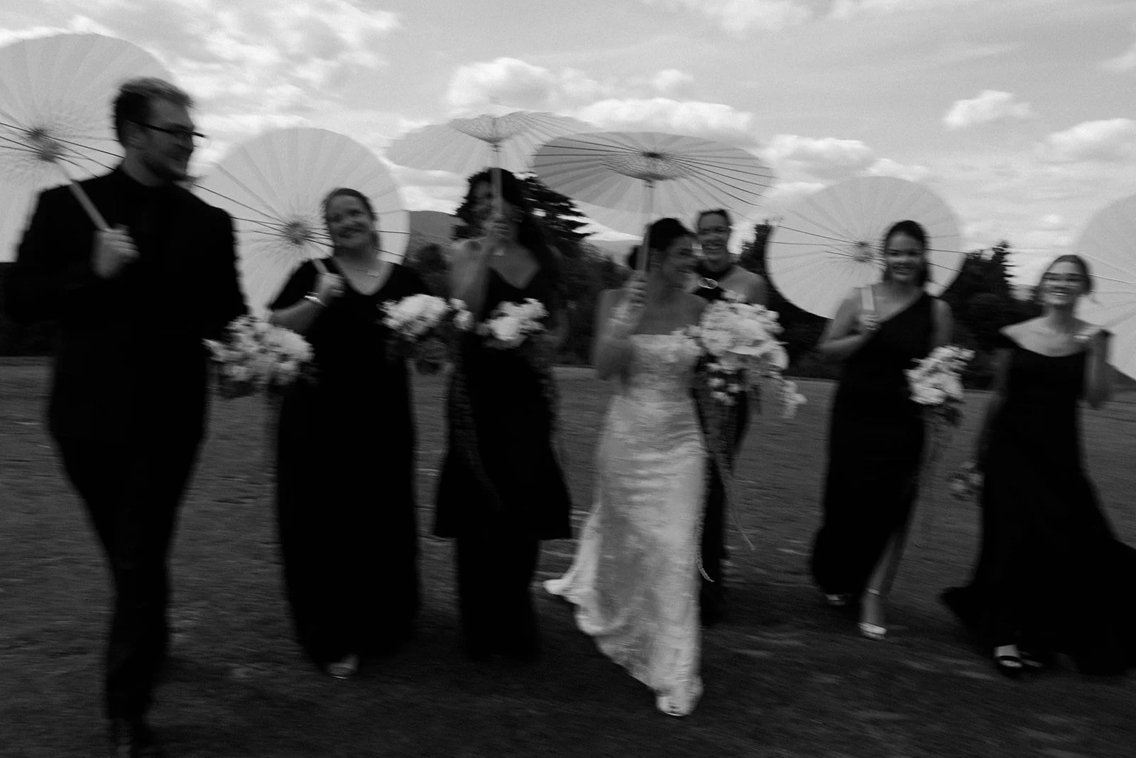 A bride walking with her bridal party
