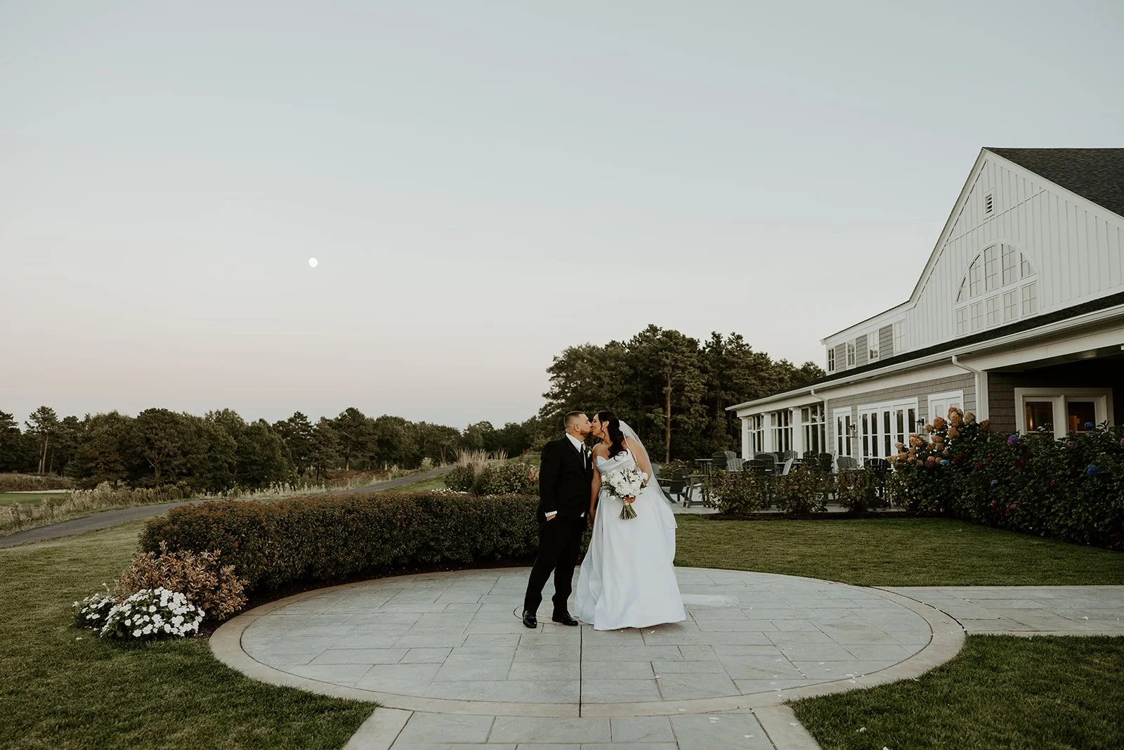 A bride and groom kissing at WAverly Oaks