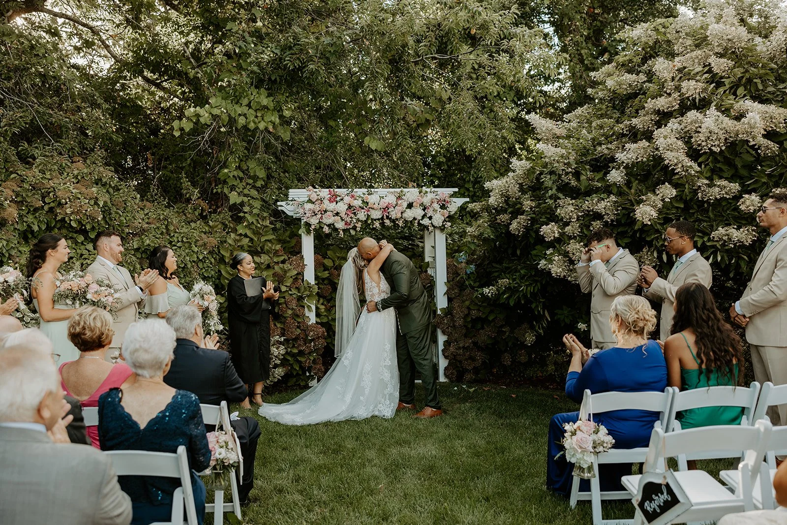 A bride and groom's first kiss at their Dennis Inn wedding