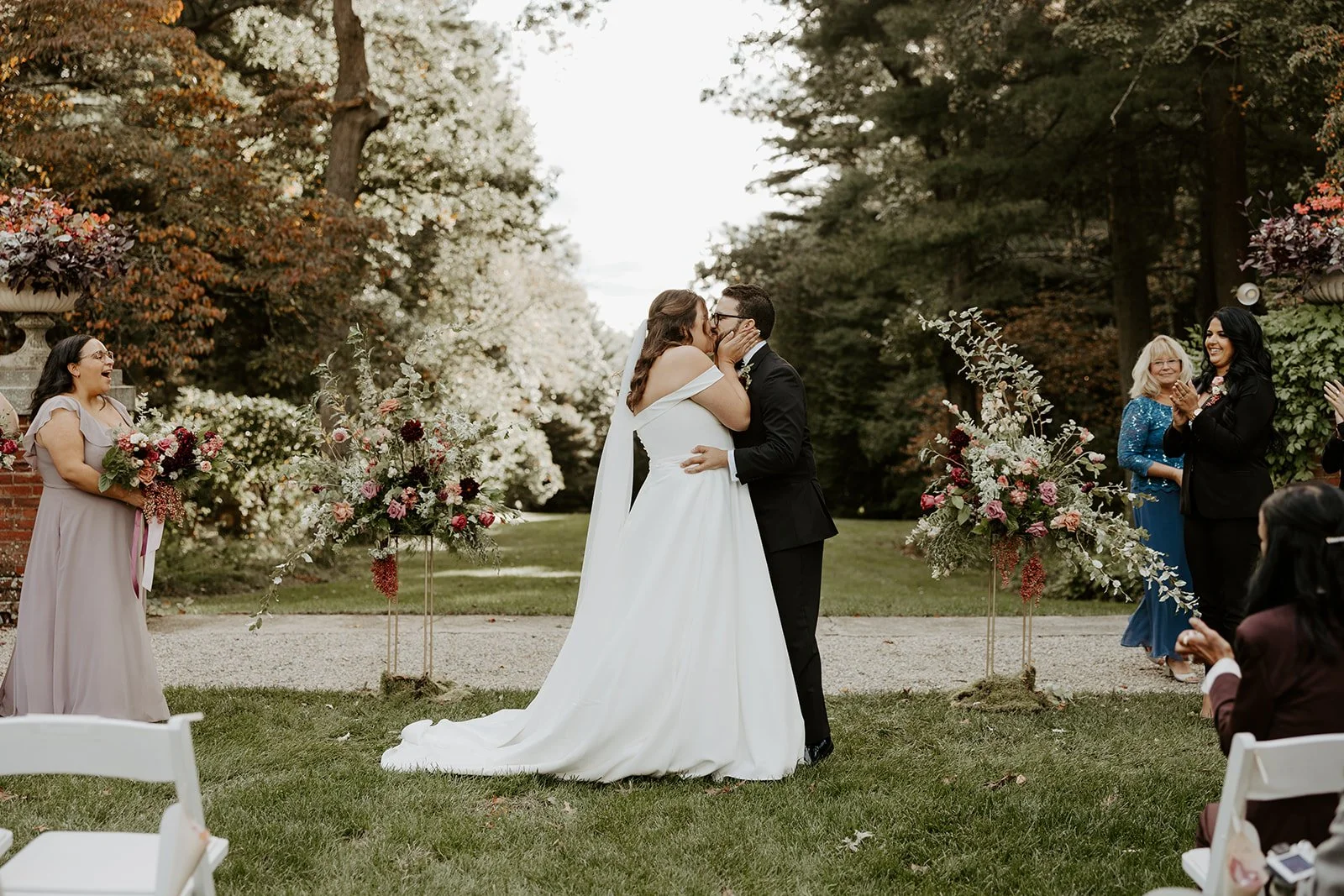 A bride and groom's first kiss at their bradley estate wedding