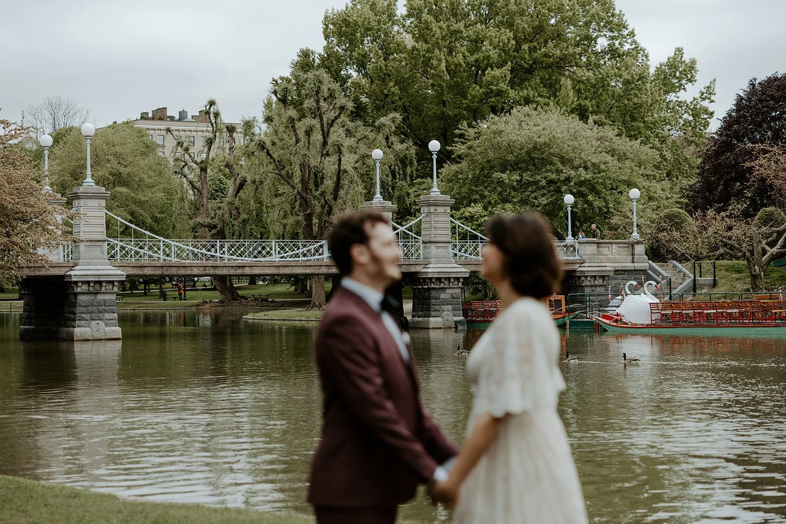 A couple posing at one of my favorite elopement locations in Boston, the Charles Rive Esplanade