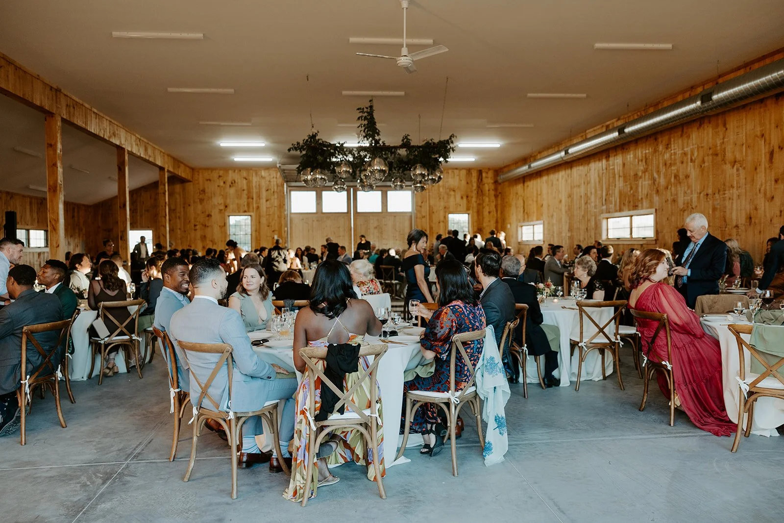 Guests at a backyard wedding reception