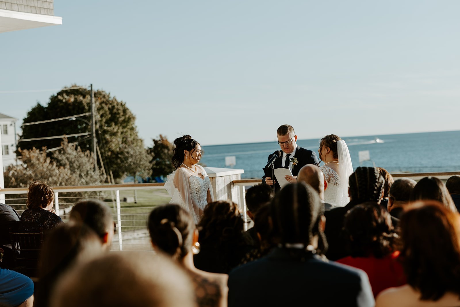 Wedding guests watching a wedding ceremony after the wedding planning checklist is complete