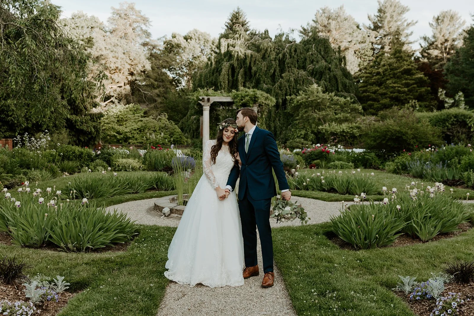 A couple posing for wedding photos at Glen Magna Farms