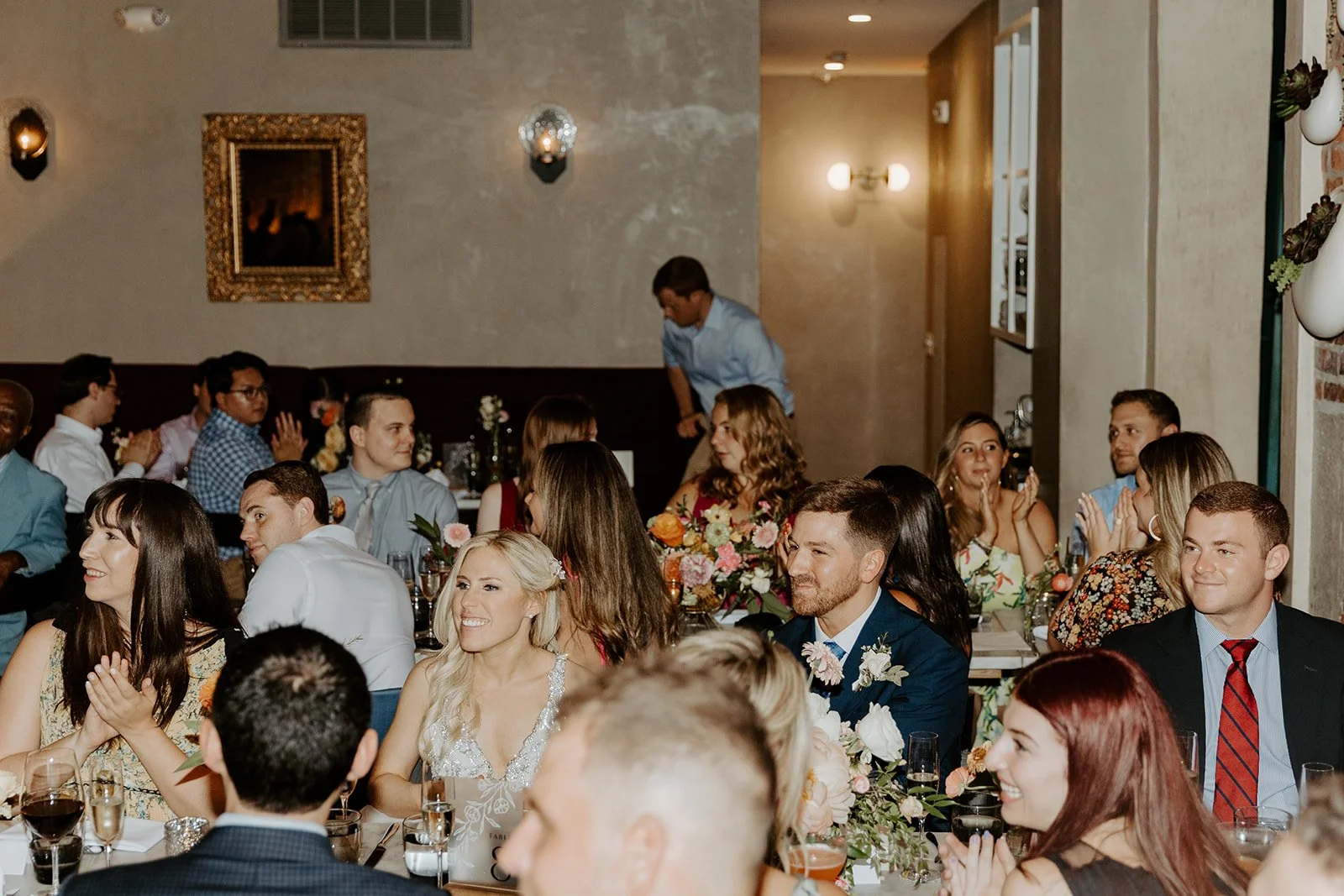 A candid photo of a restaurant wedding reception