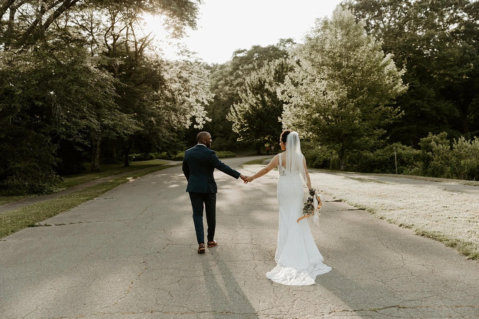 A couple walking away after their Boston elopement