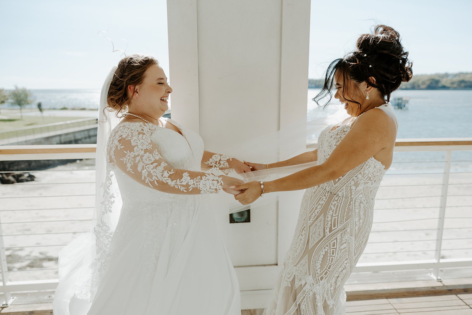 Two brides during their first look at a Beauport Hotel wedding