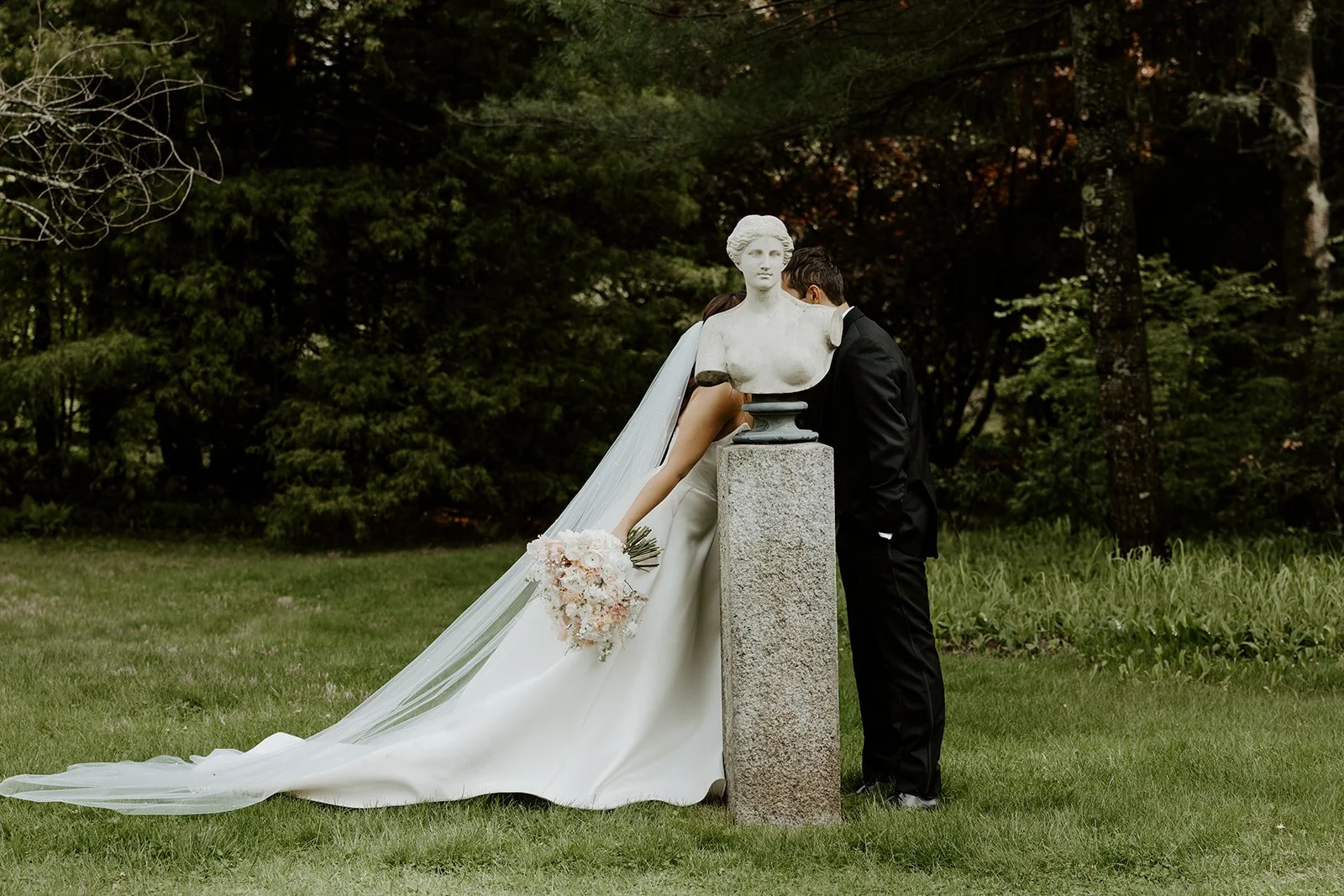 A bride and groom taking wedding photos