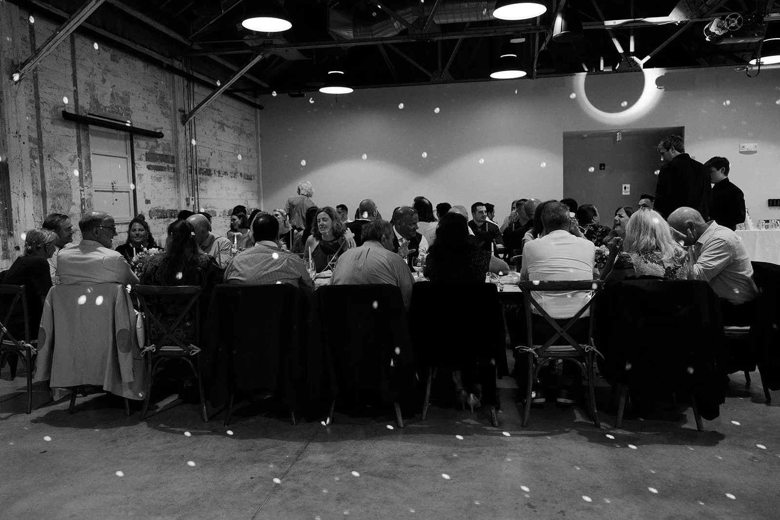 An indoor wedding reception at garage b with a disco ball