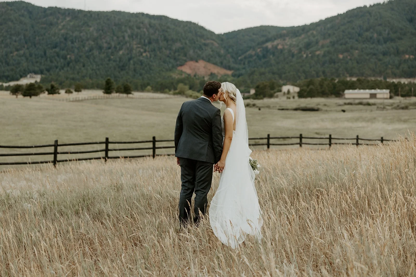 A bride and groom kissing at their destination wedding