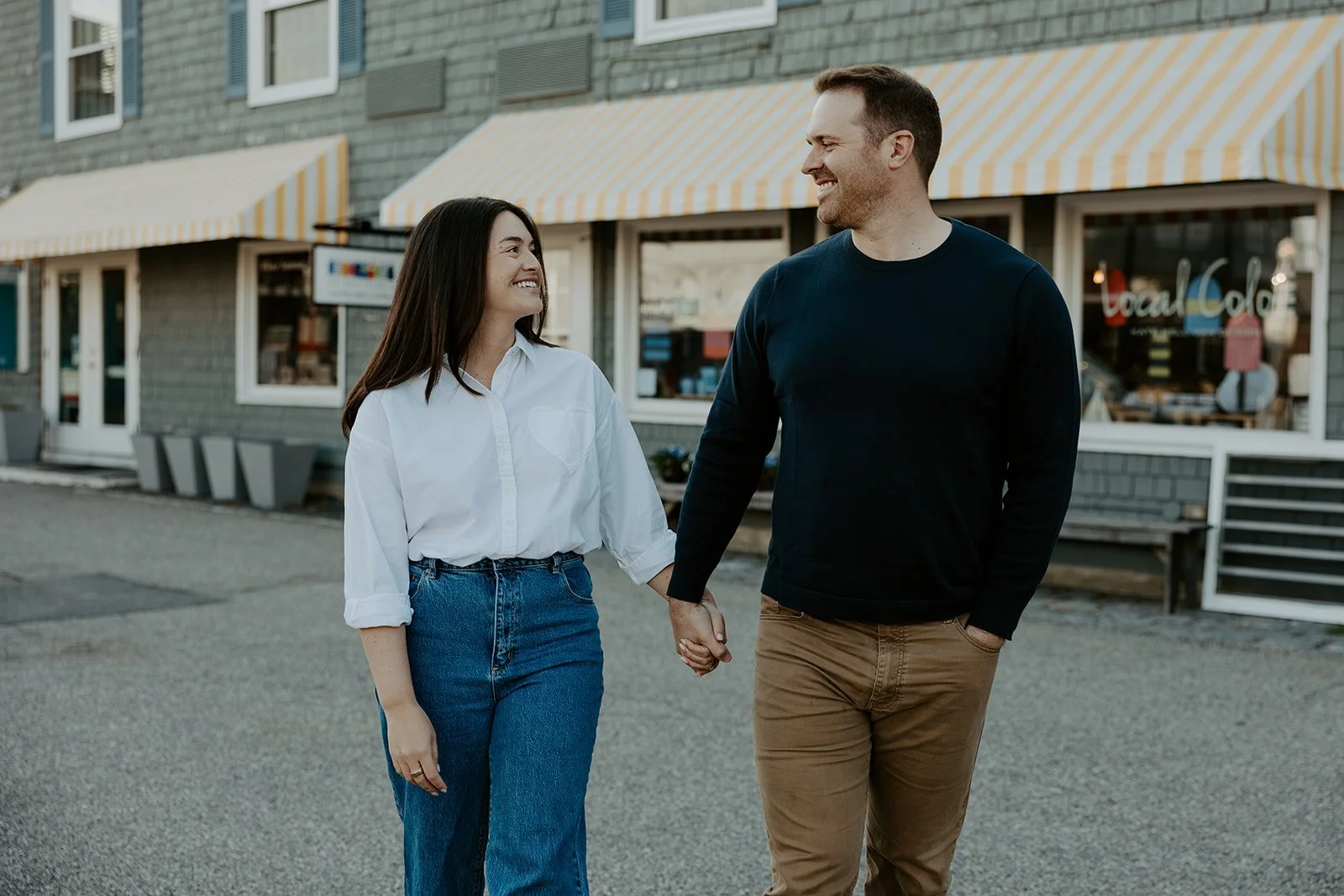 A couple in casual outfits showing what to wear for engagement photos