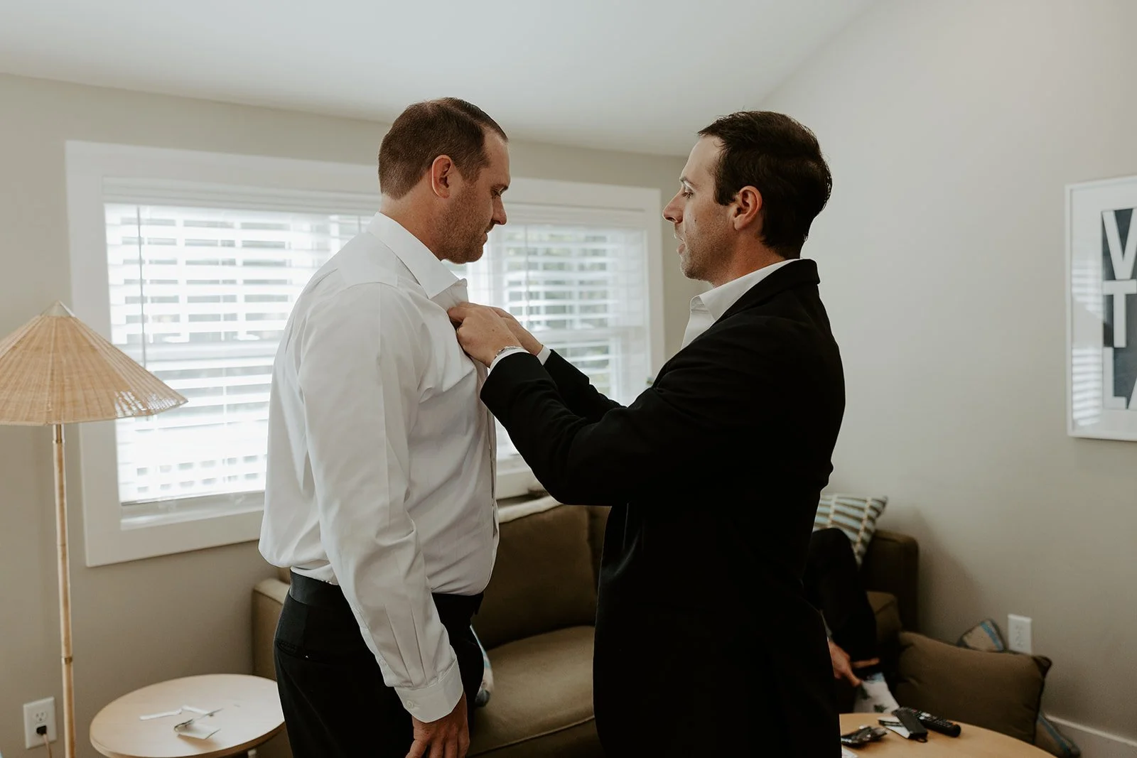 A groom getting ready in his childhood bedroom