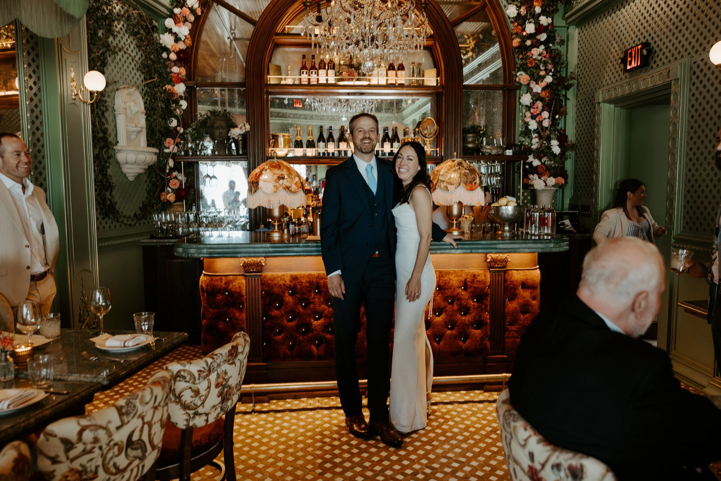 A couple celebrating at dinner after their boston elopement