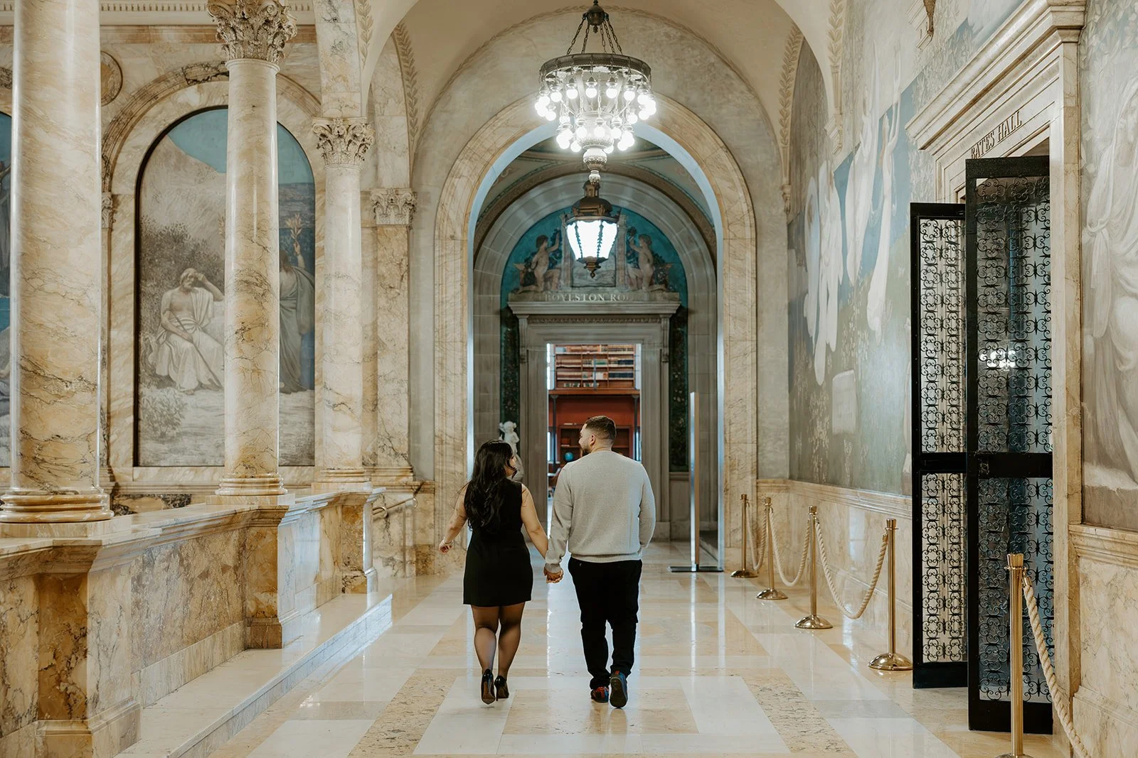 A couple taking art museum engagement photos