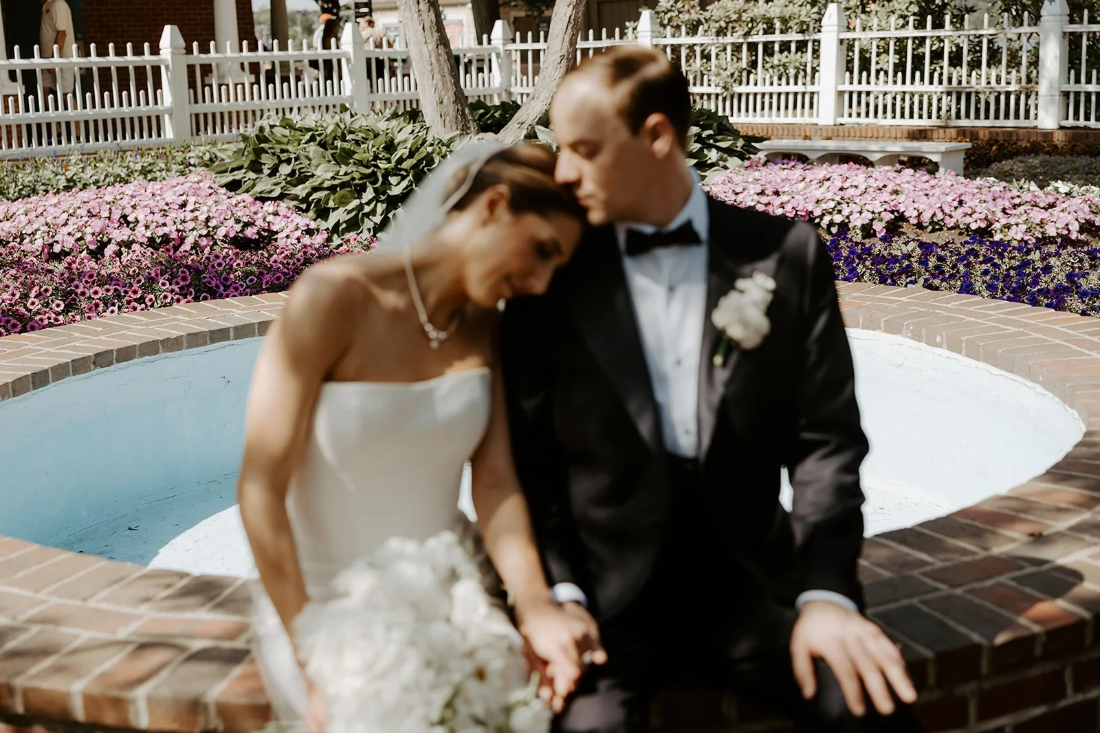 A bride and groom taking wedding photos