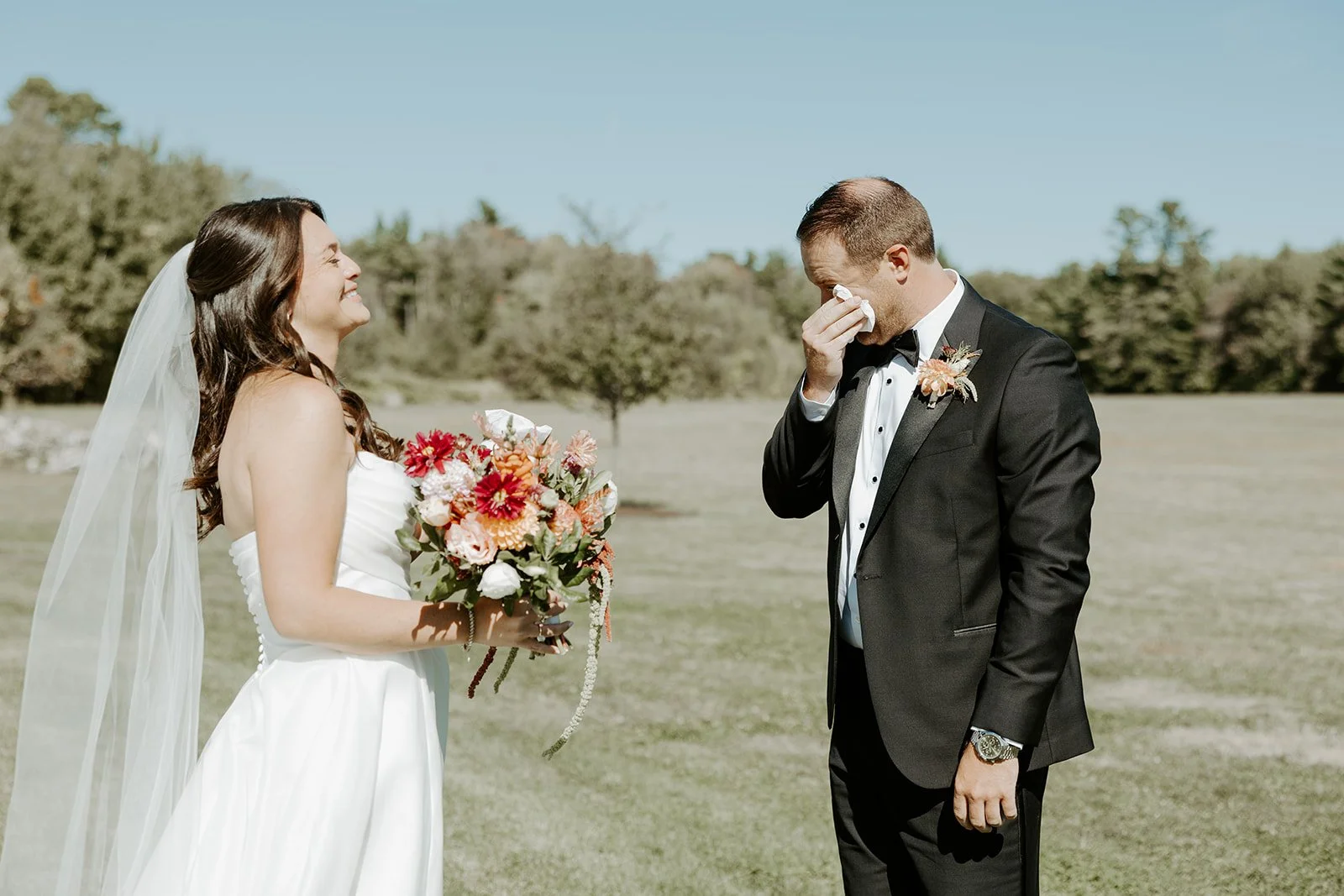 A groom crying during a first look with his bride