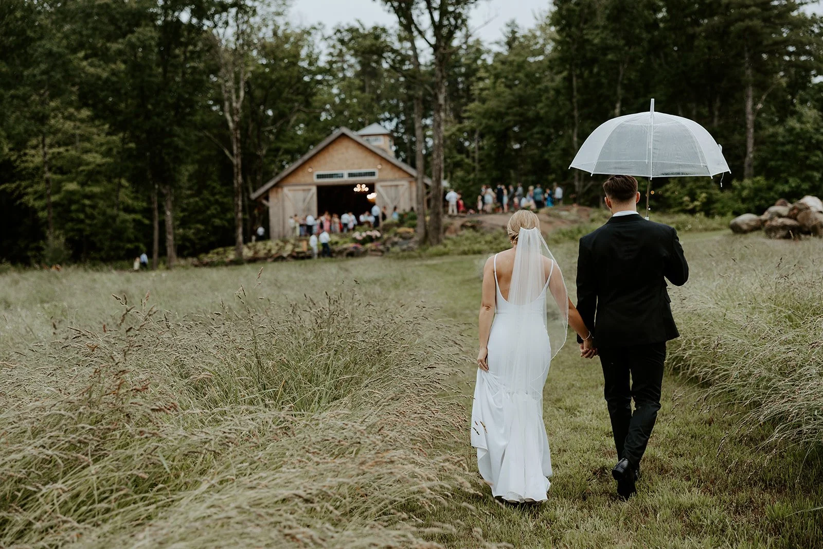 A bride and groom walking tot heir reception